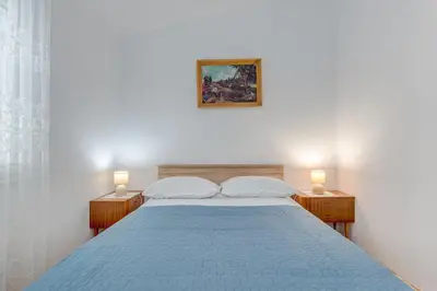Krevet ili kreveti u jedinici u objektu Seafront apt with terrace 4 bedrooms and mooring