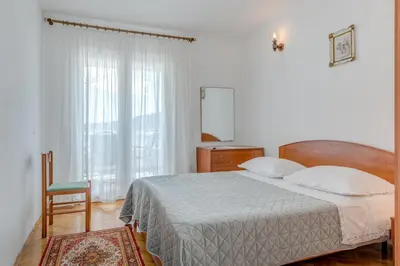 Krevet ili kreveti u jedinici u objektu Seafront apt with terrace 4 bedrooms and mooring