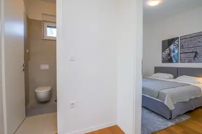 Krevet ili kreveti u jedinici u objektu Villa Tramontana apartment 1