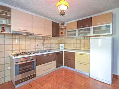 Kuhinja ili čajna kuhinja u objektu Holiday Home Karmela by Interhome