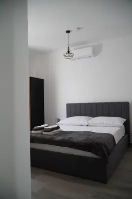 Krevet ili kreveti u jedinici u objektu Fjaka Apartments & Rooms