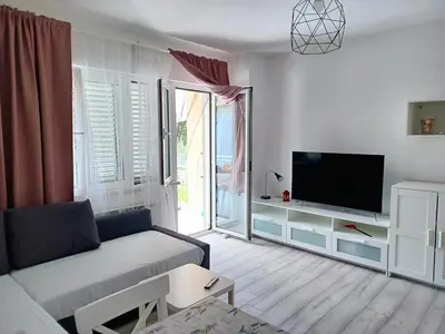 TV i/ili zabavni centar u objektu Apartmani Rameša