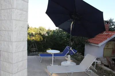 Popločani dio dvorišta ili vanjski dio objekta Beach House Paradiso