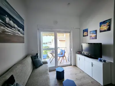 TV i/ili zabavni centar u objektu Seaview apartment at beach
