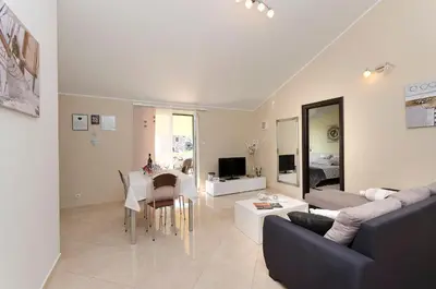 TV i/ili zabavni centar u objektu Apartments Family idyll