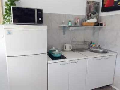 Kuhinja ili čajna kuhinja u objektu Sunny Stretto apartments