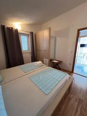 Krevet ili kreveti u jedinici u objektu Apartmani 4 Delfina Rogoznica