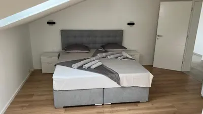 Krevet ili kreveti u jedinici u objektu Jednosobni apartman s pogledom na more