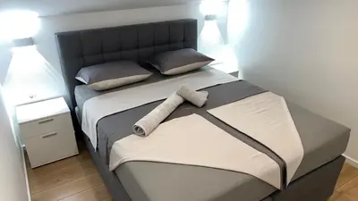Krevet ili kreveti u jedinici u objektu Dvosobni apartman s pogledom na more