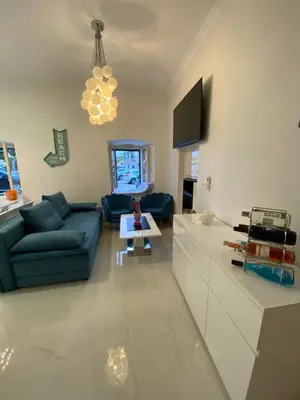 TV i/ili zabavni centar u objektu Beach House Tisno whit Sea View