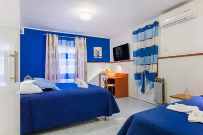 Krevet ili kreveti u jedinici u objektu Apartments and Rooms Villa Marija
