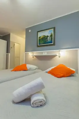 Krevet ili kreveti u jedinici u objektu Apartments and Rooms Villa Marija