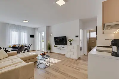 TV i/ili zabavni centar u objektu Villa Corcovado Deluxe Apartments with Heated Pool