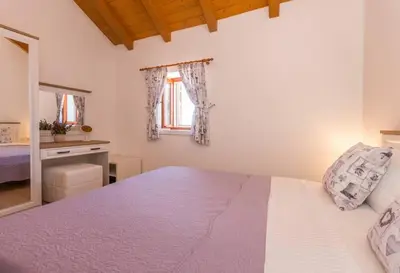Krevet ili kreveti u jedinici u objektu The Grandfather's courtyard villa with heated pool