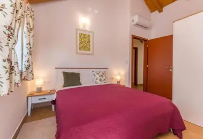 Krevet ili kreveti u jedinici u objektu The Grandfather's courtyard villa with heated pool
