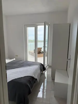 Krevet ili kreveti u jedinici u objektu SEASPRAY APARTMENTS TISNO