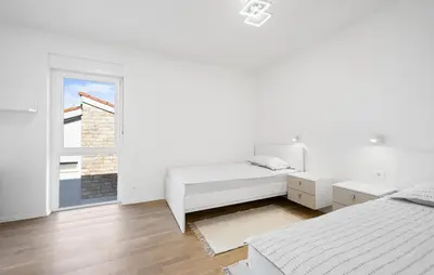 Krevet ili kreveti u jedinici u objektu Apartments Adriatic
