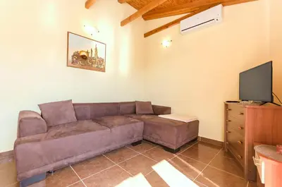 TV i/ili zabavni centar u objektu Apartments Peaceful port