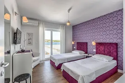 Krevet ili kreveti u jedinici u objektu Villa La Perla