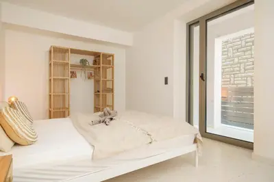 Krevet ili kreveti u jedinici u objektu Exklusives Strandapartment mit Parkplatz & direktem Zugang zum Meer