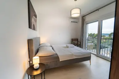 Krevet ili kreveti u jedinici u objektu Rooftop Holiday House
