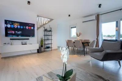 TV i/ili zabavni centar u objektu Rooftop Holiday House