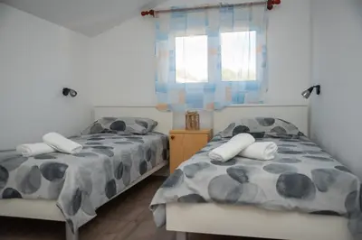 Krevet ili kreveti u jedinici u objektu Apartman Jadrija Šibenik 2