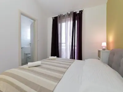 Krevet ili kreveti u jedinici u objektu Apartments Helena - One bedroom apartment with Balcony and Sea View - A1