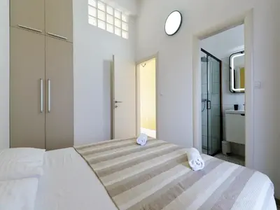 Krevet ili kreveti u jedinici u objektu Apartments Helena - One bedroom apartment with Balcony and Sea View - A1