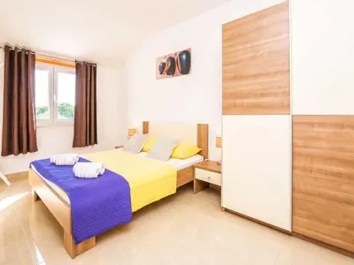 Krevet ili kreveti u jedinici u objektu Holiday Home Marinela - Four Bedroom Holiday Home with Swimming Pool