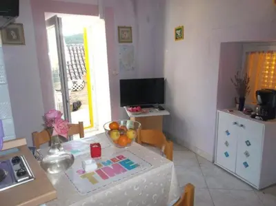 TV i/ili zabavni centar u objektu Apartments Sunce - One Bedroom Apartment with Sea View and Terrace