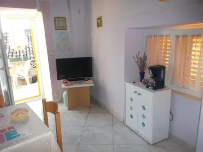 TV i/ili zabavni centar u objektu Apartments Sunce - One Bedroom Apartment with Sea View and Terrace