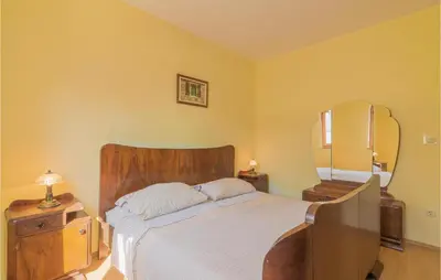 Krevet ili kreveti u jedinici u objektu Two-Bedroom Holiday Home Jezera With A Fireplace 05