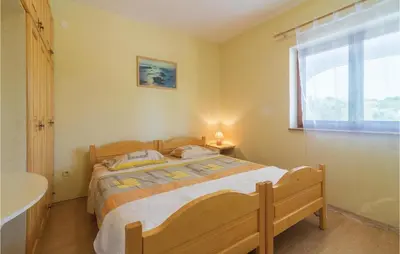 Krevet ili kreveti u jedinici u objektu Two-Bedroom Holiday Home Jezera With A Fireplace 05