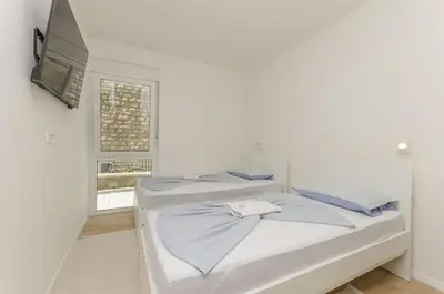 Krevet ili kreveti u jedinici u objektu Apartments Adriatic with pool