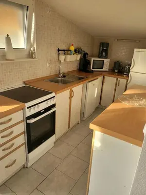 Kuhinja ili čajna kuhinja u objektu Apartment Olive shared pool