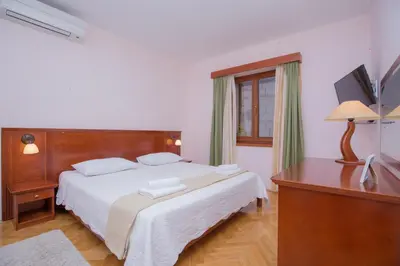 Krevet ili kreveti u jedinici u objektu Rooms Plava Laguna