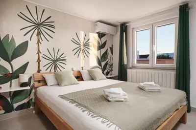 Krevet ili kreveti u jedinici u objektu Villa Mia - Moderne Oase mit Meerblick und Pool