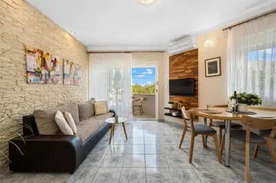 TV i/ili zabavni centar u objektu Aquarius Apartments - Beachside with Heated Pool