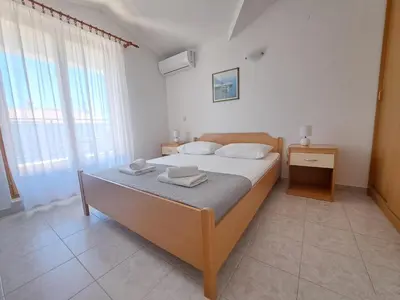 Krevet ili kreveti u jedinici u objektu Apartments and Rooms Saric