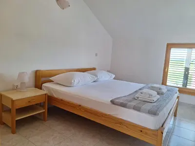 Krevet ili kreveti u jedinici u objektu Apartments and Rooms Saric