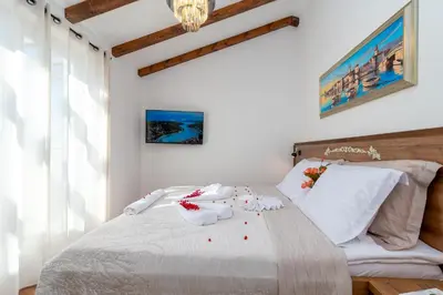 Krevet ili kreveti u jedinici u objektu Luxury Stone Villa Smokvica, Heated Pool, Sauna, Jacuzzi, Sea View