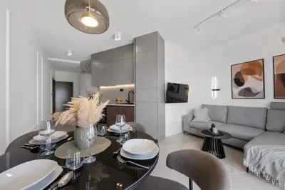 TV i/ili zabavni centar u objektu Luxury Aquarius Apartments - Beachside with Hot Tub