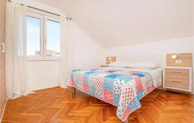 Krevet ili kreveti u jedinici u objektu Two-Bedroom Apartment Vodice With Sea View 06