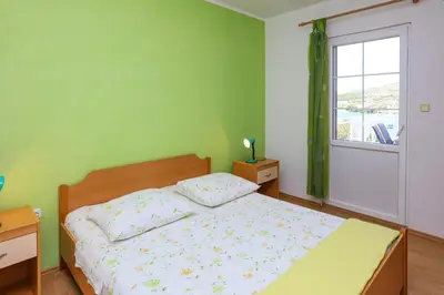 Krevet ili kreveti u jedinici u objektu Apartments by the sea Sparadici, Sibenik - 23939