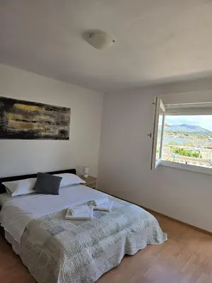Krevet ili kreveti u jedinici u objektu Apartmani Dino