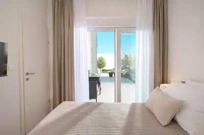 Krevet ili kreveti u jedinici u objektu Hillside Apartments Murter