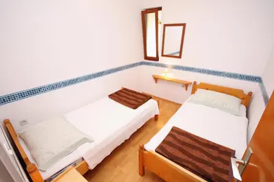 Krevet ili kreveti u jedinici u objektu Apartments by the sea Jezera, Murter - 5063