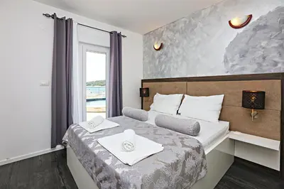 Krevet ili kreveti u jedinici u objektu Family-friendly apartments with swimming pool Zecevo Rtic, Rogoznica - 8366