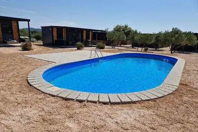 Bazen u objektu Family-friendly apartments with swimming pool Pirovac, Sibenik - 24299 ili u blizini